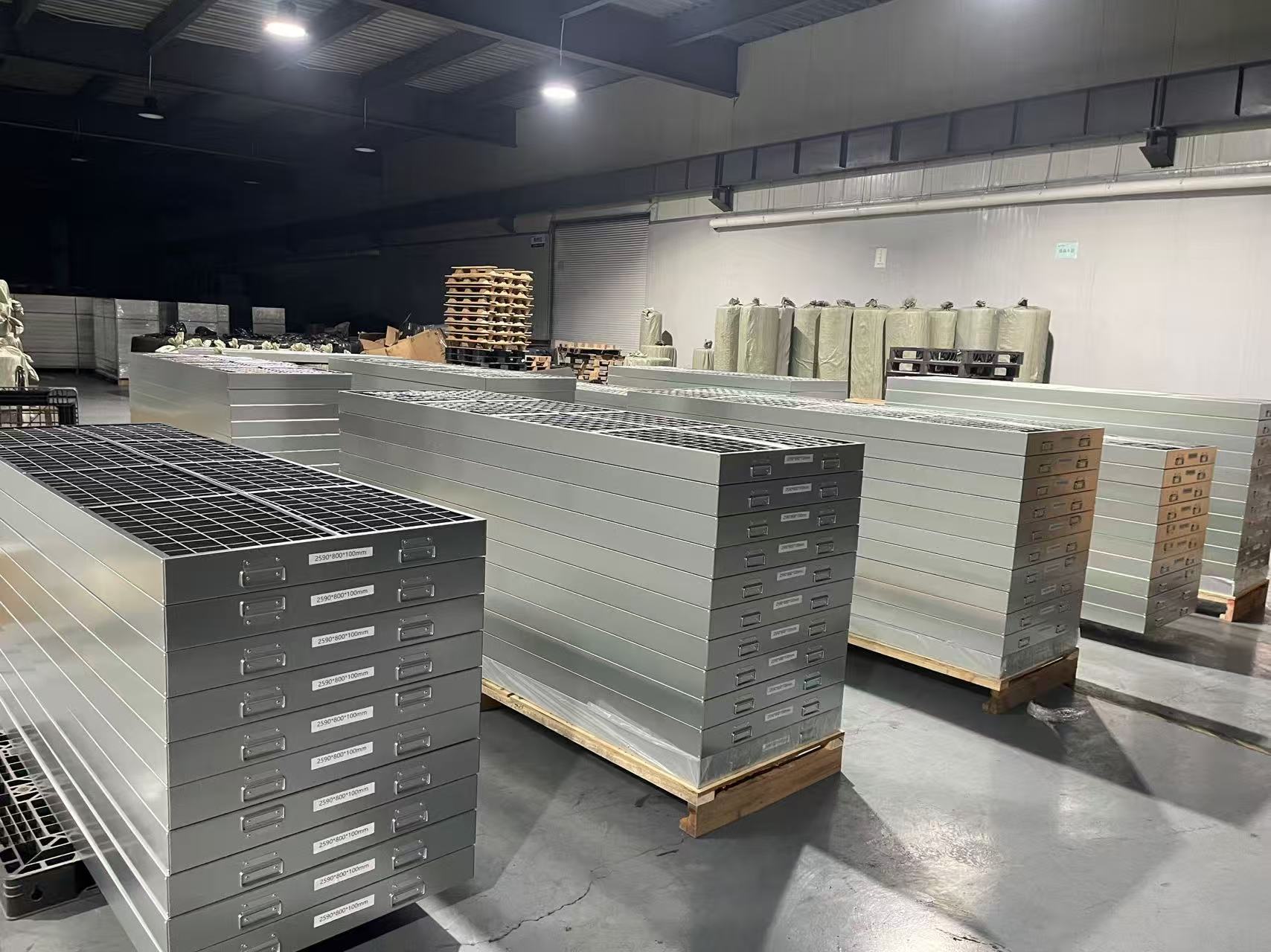 Finished custom activated carbon filters stacked in workshop