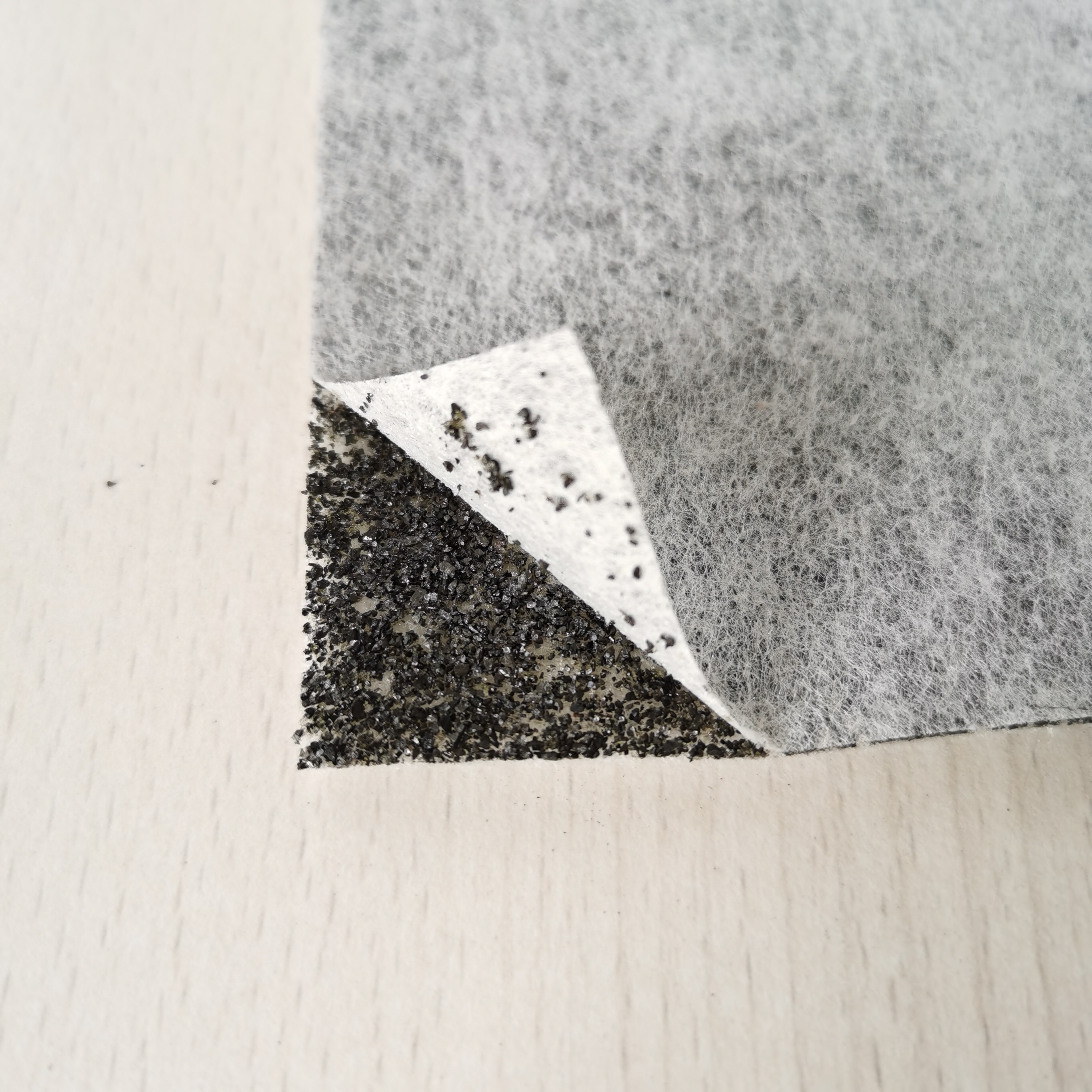 Carbon impregnated nonwoven fabric filter media